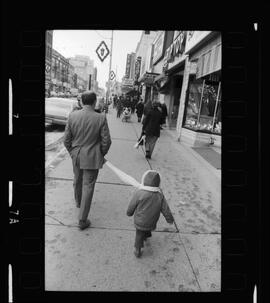 Kid Led By Scarf Used As Leash, Christmas Shopping